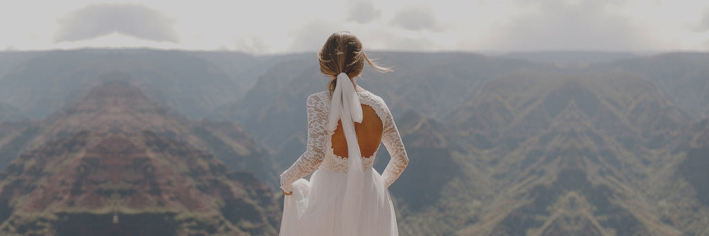 Bride in mountains wearing Rory 2.0 keyhole back wedding dress