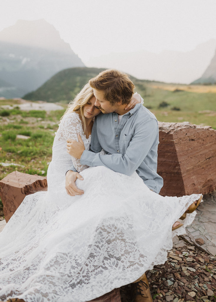 Groom holding bride in Glacier National Park